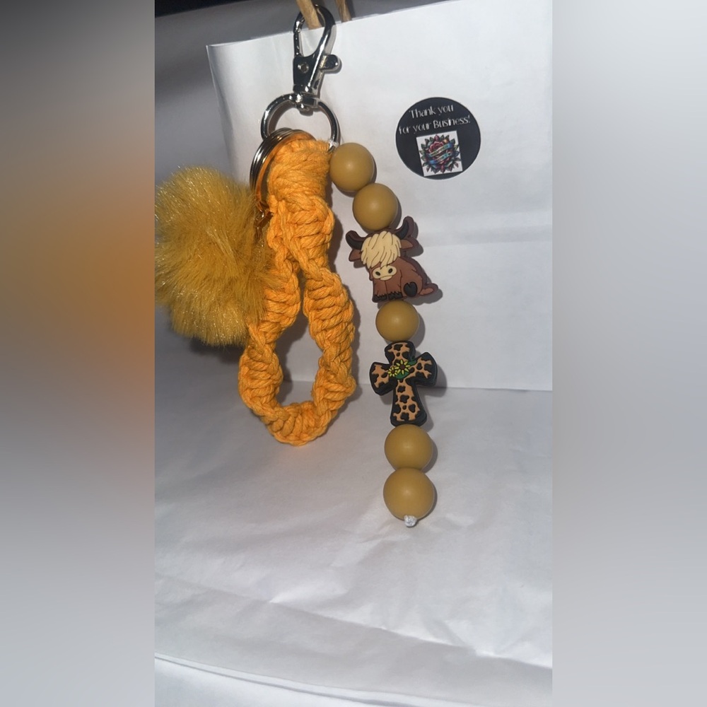 Homemade macrame keychain with accessories